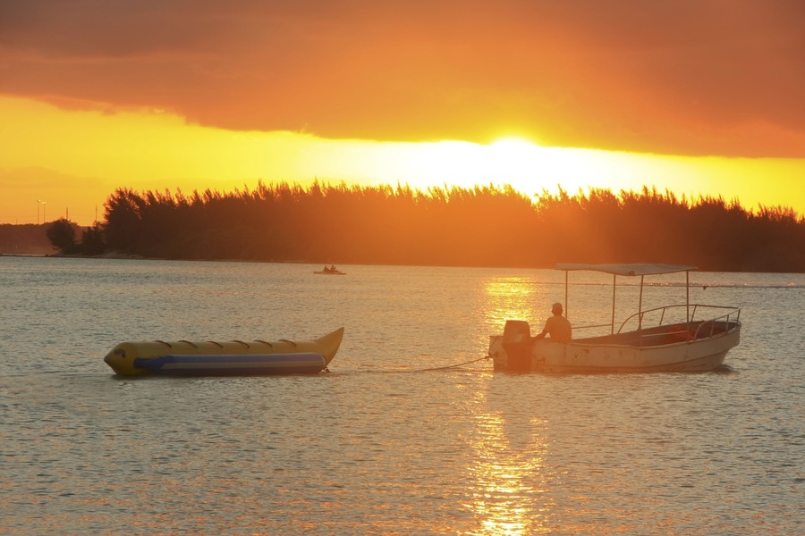 Banana boat in Boca Chica bay at sunset, Dominican Republic