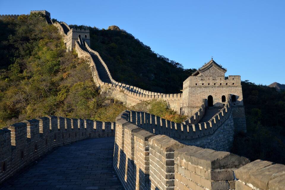 The Great Wall of China winding through a mountainous landscape.