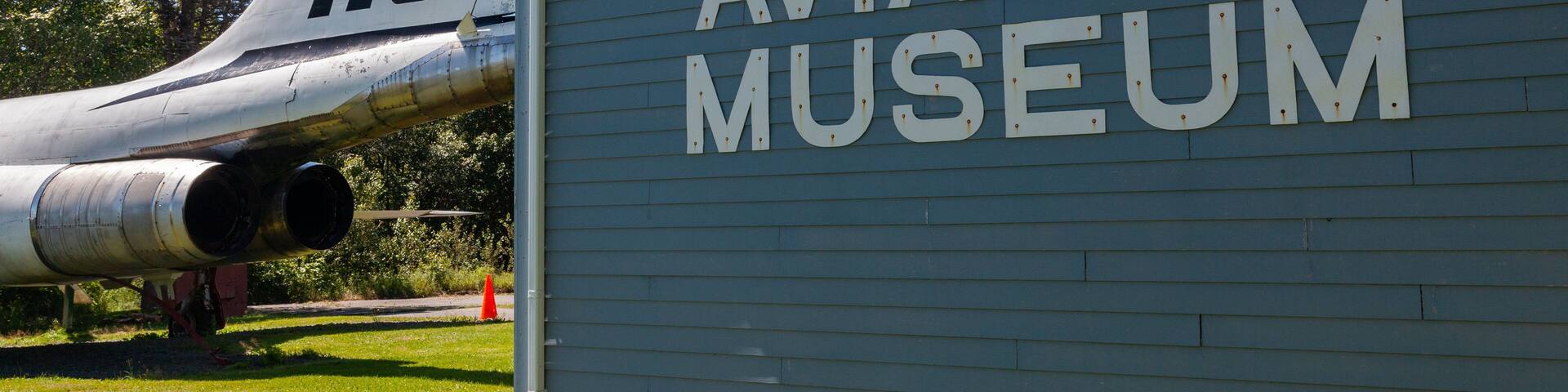 The exterior of the Atlantic Canada Aviation Museum with a vintage aircraft labeled "416" in the background.