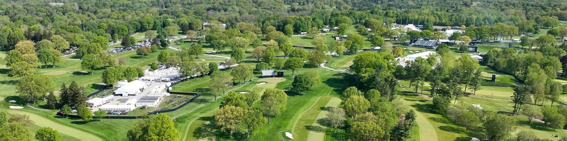 PGA Championship 2023 Golf course with greens and fairways at Oak Hill Country Club Pittsford, NY during morning course prep by staff and media