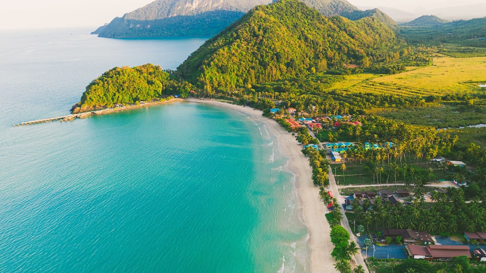 Beach and Sea and mountain Top View , Wave of Turquoise ocean water on sandy beach, High angle view sea and sand background, Aerial top view of Khanom beach, Khanom, Nakhon Si Thammarat Thailand