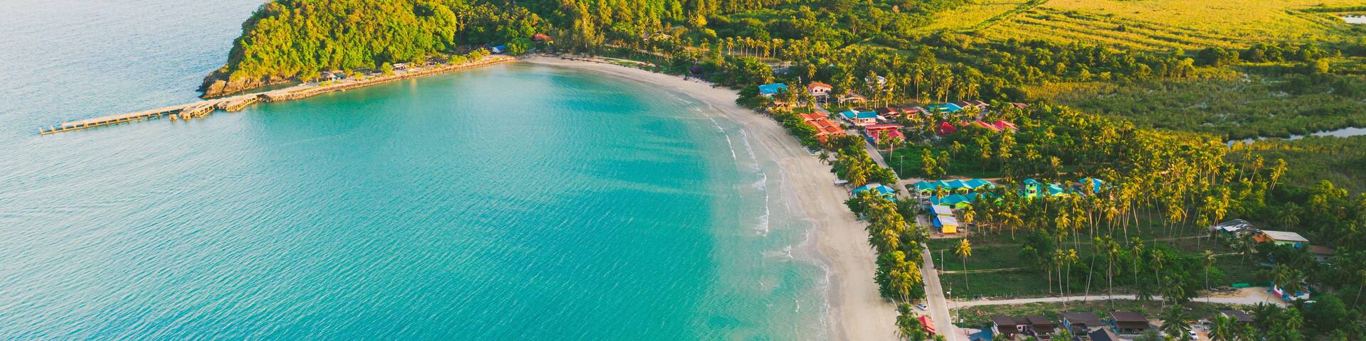 Beach and Sea and mountain Top View , Wave of Turquoise ocean water on sandy beach, High angle view sea and sand background, Aerial top view of Khanom beach, Khanom, Nakhon Si Thammarat Thailand