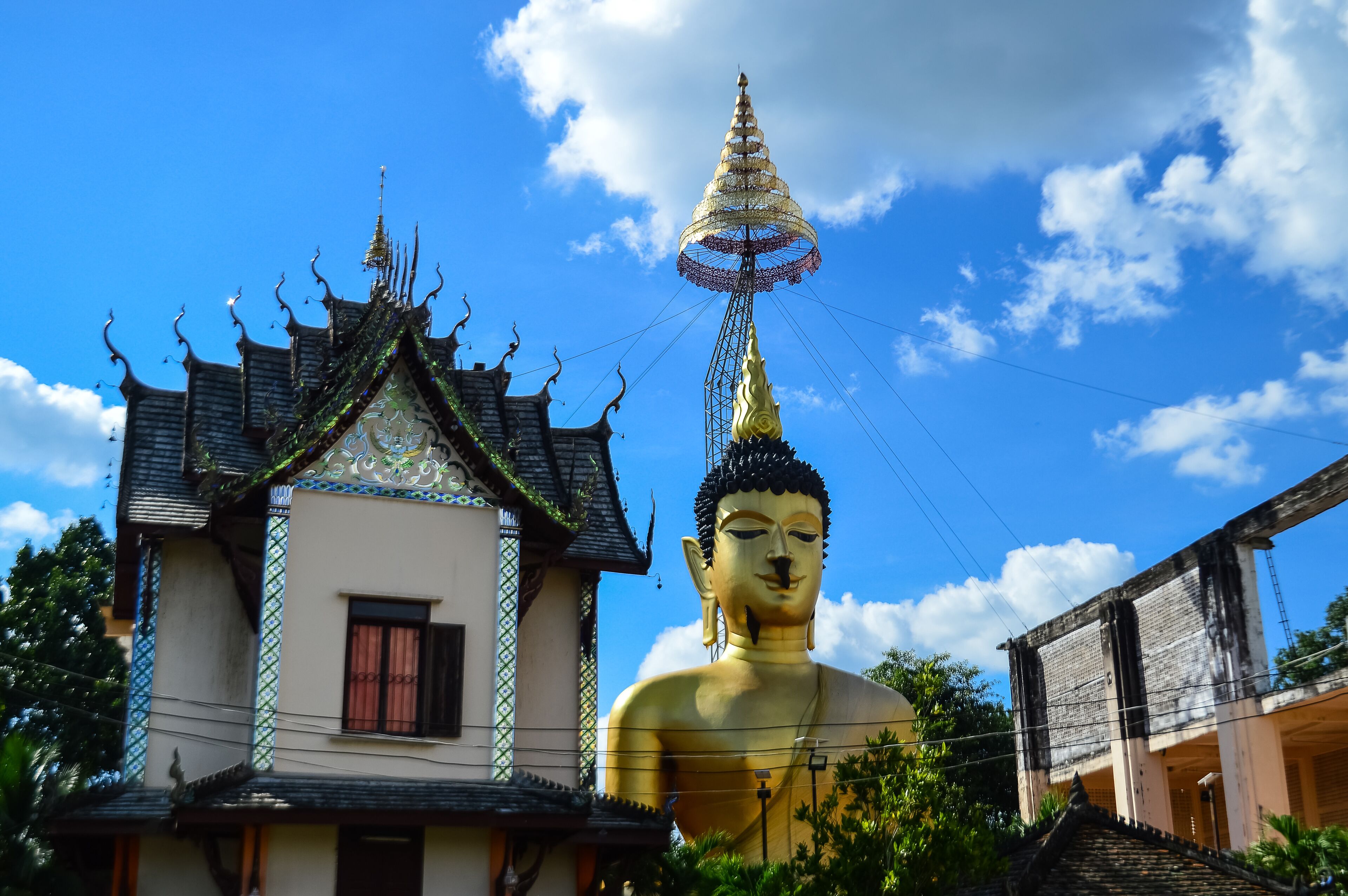 Golden Buddha Statue and Chapel, Lanna Architecture, Symbols of Buddhism, South East Asia at Wat Phra Phuttha Santiparangon Sri Phingkhonakhon Mongkhon (Phra Chao Ton Luang) Chiang Mai, Northern Thail