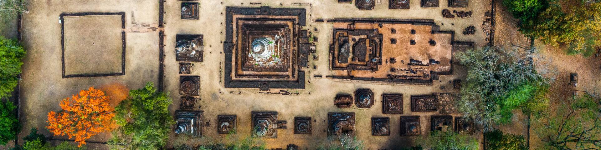 Aerial top down view of Sukhothai Thailand Si Satchanalai Historical Park, showcasing its ancient ruins and vibrant, strong colors