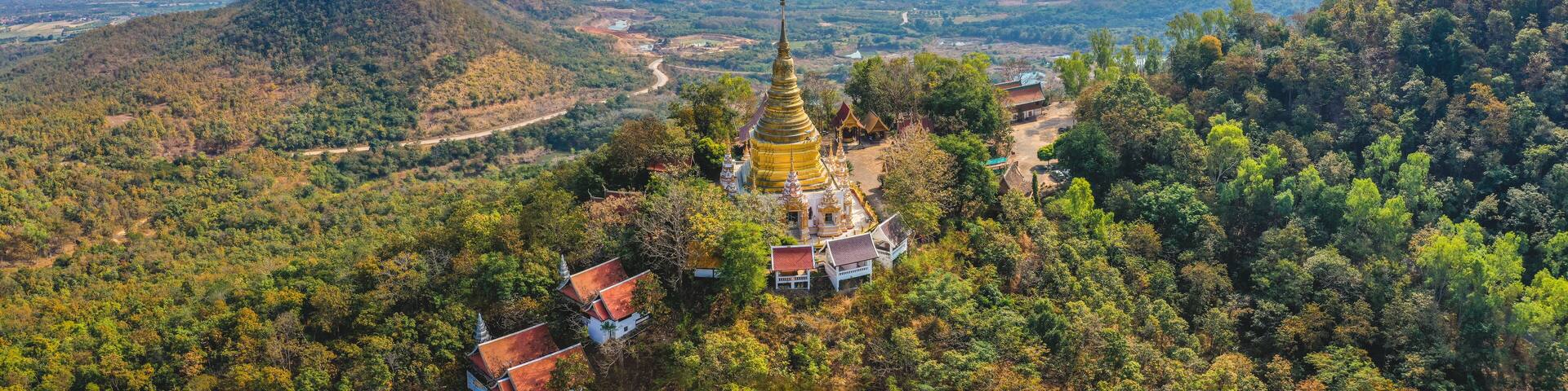 Aerial view of Wat Phra Phutthabat Tak Pha temple on top of the mountain in Lamphun, Thailand