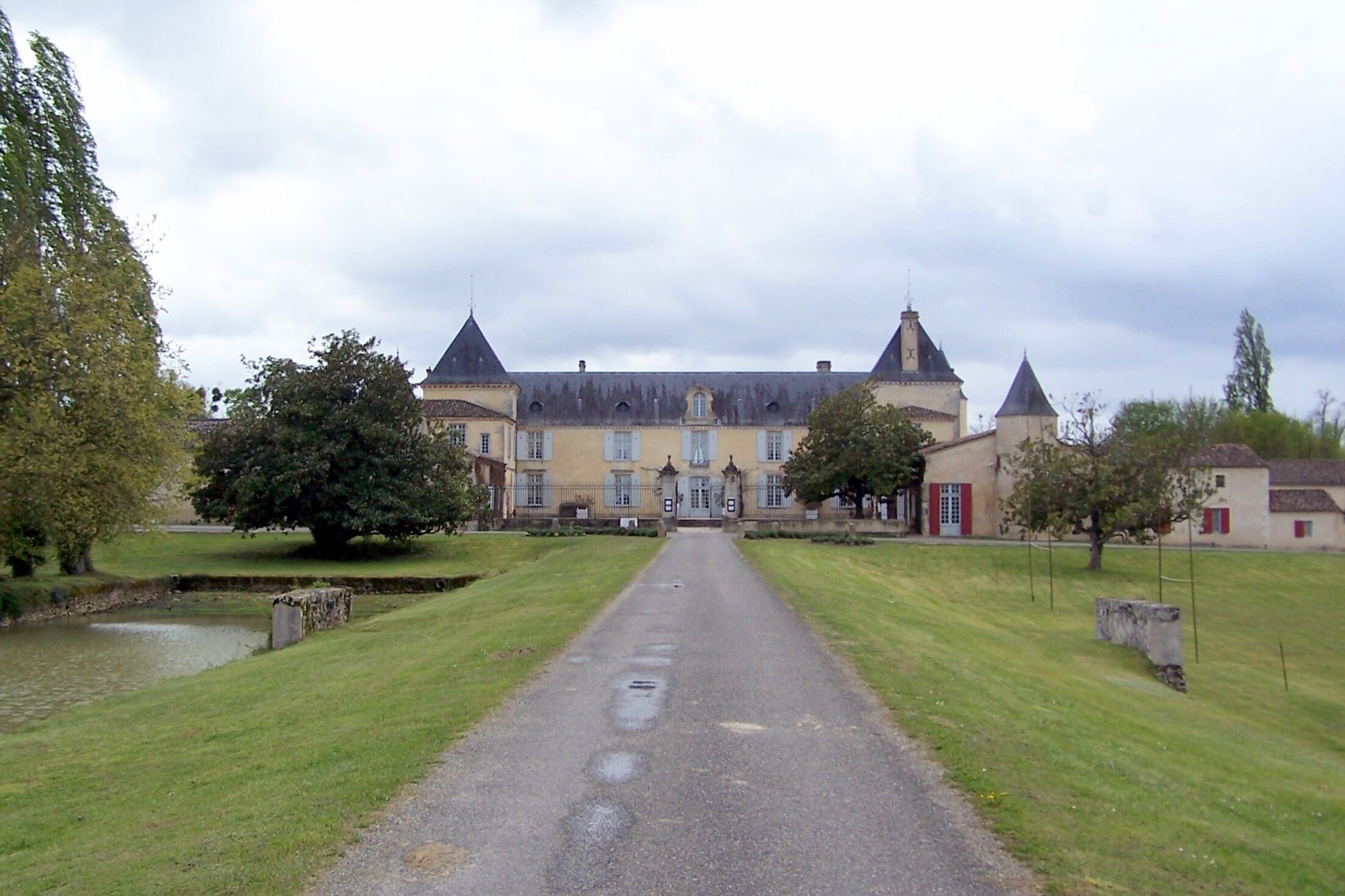 A large, historic building with multiple towers and a central entrance.