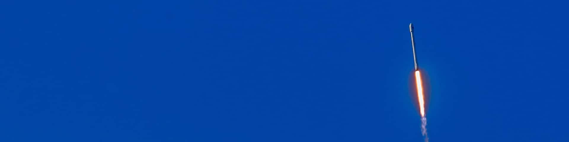 Lompoc, California, USA - January 14, 2017: Vandenberg Air Force Base where Spacex launched this morning a Falcon 9 rocket. The rocket in the blue air fifteen seconds after takeoff. Fire and smoke.