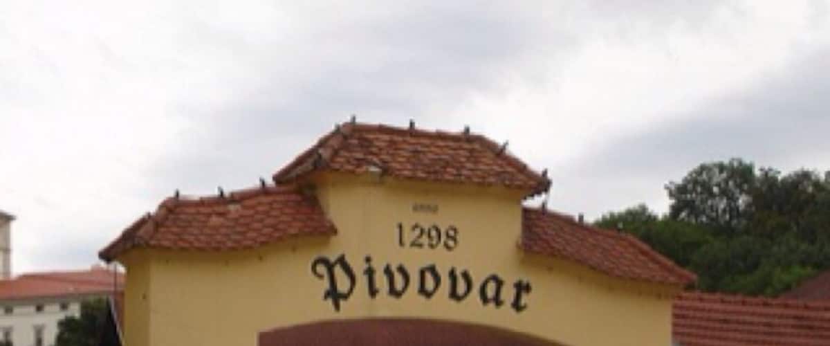 A building with a sign reading "Pivovar" and the number "1298" above it.