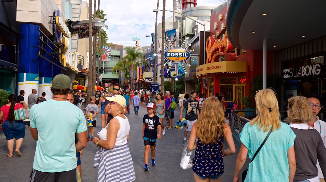 Universal CityWalk showing street scenes and signage as well as a large group of people
