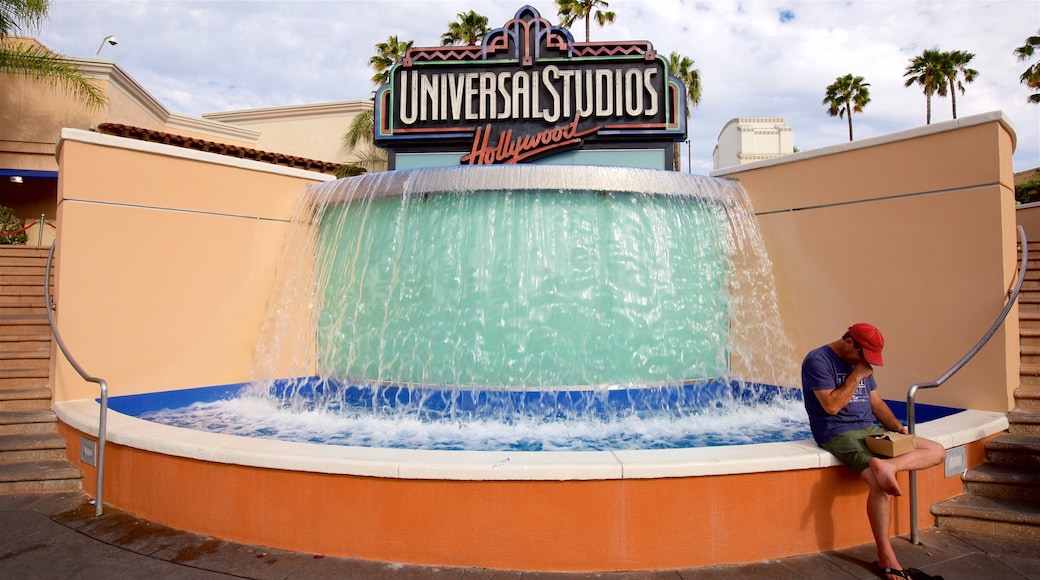 Universal CityWalk showing signage, rides and a fountain