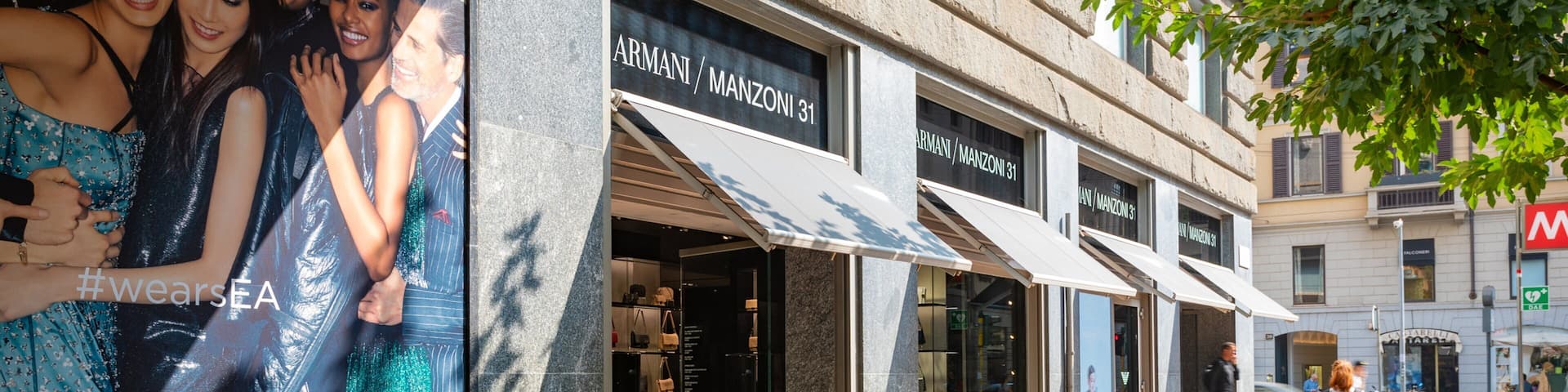 Armani Megastore showing signage and street scenes as well as an individual femail