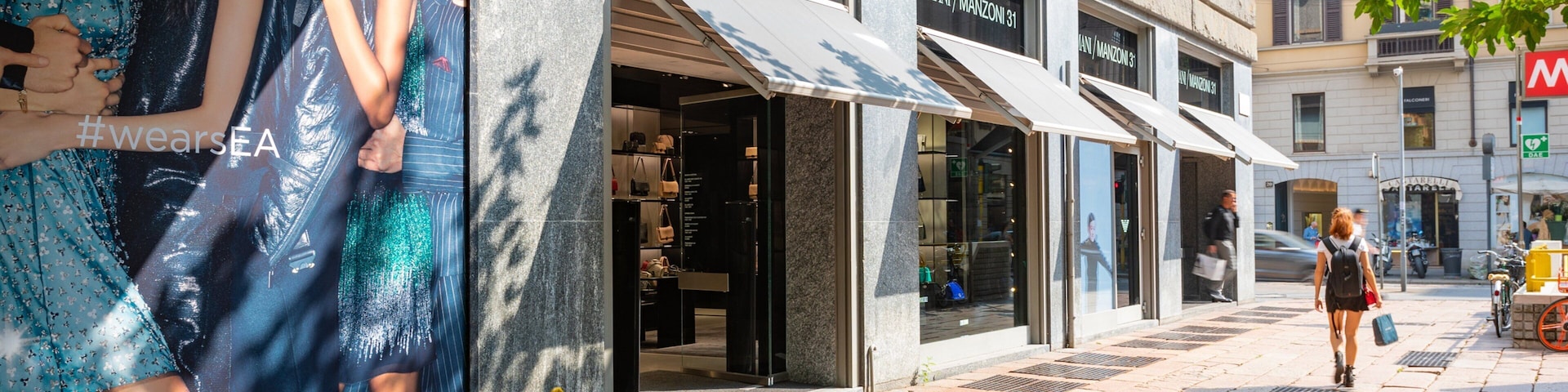 Armani Megastore showing signage and street scenes as well as an individual femail