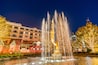 Night view of the fountain and the public art Spirit with christmas tree of American Youth in The Americana at Brand