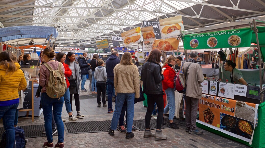 Greenwich Market which includes markets as well as a small group of people