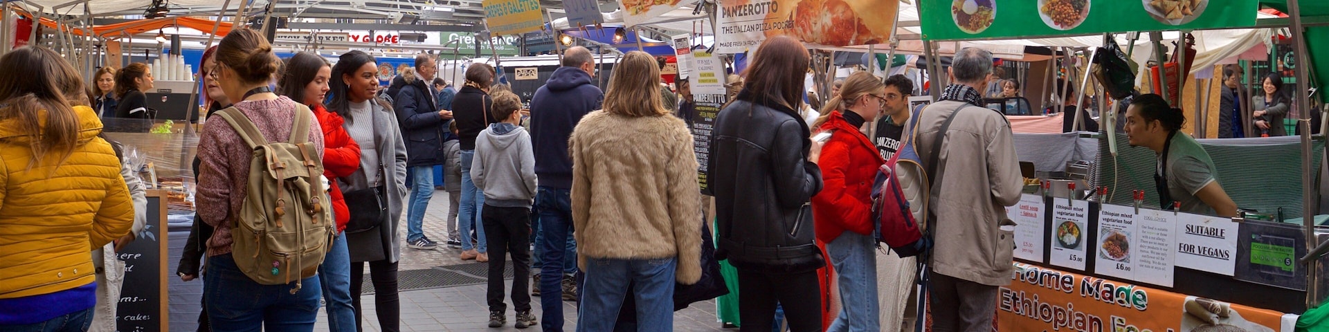 Greenwich Market which includes markets as well as a small group of people