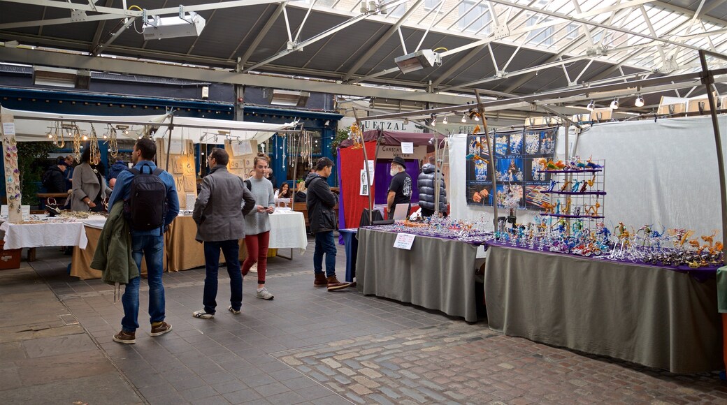 Greenwich Market featuring markets as well as a small group of people