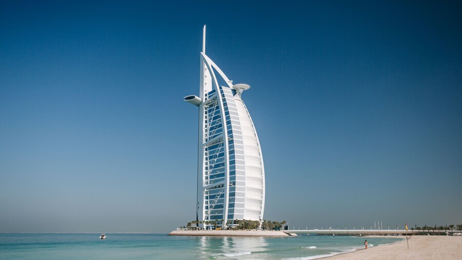 Souk Madinat Jumeirah which includes a skyscraper, general coastal views and modern architecture