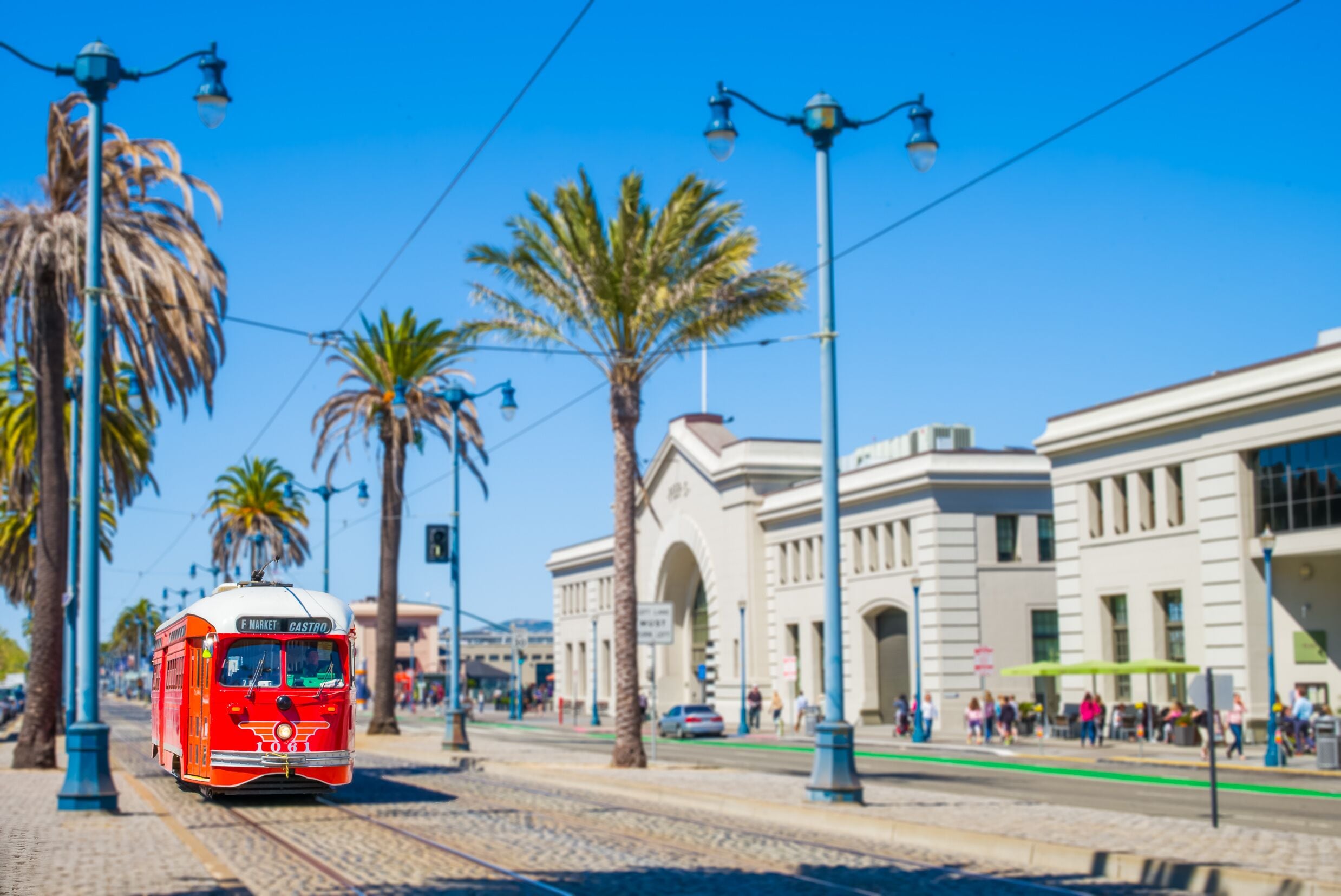 San Francisco f- streetcar, tram or muni trolley traveling down the Embarcadero on a sunny day. Vintage streetcar originally a Pacific Electric car built in 1948 trolley. Tribute livery.