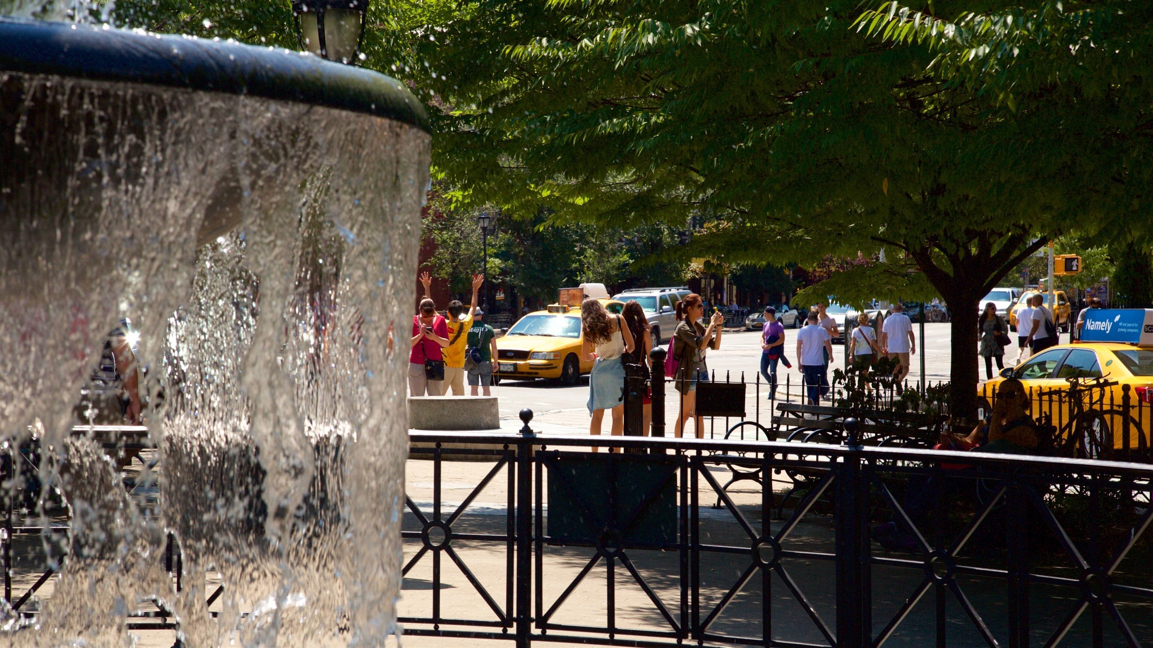 Bleecker Street showing a fountain and a garden