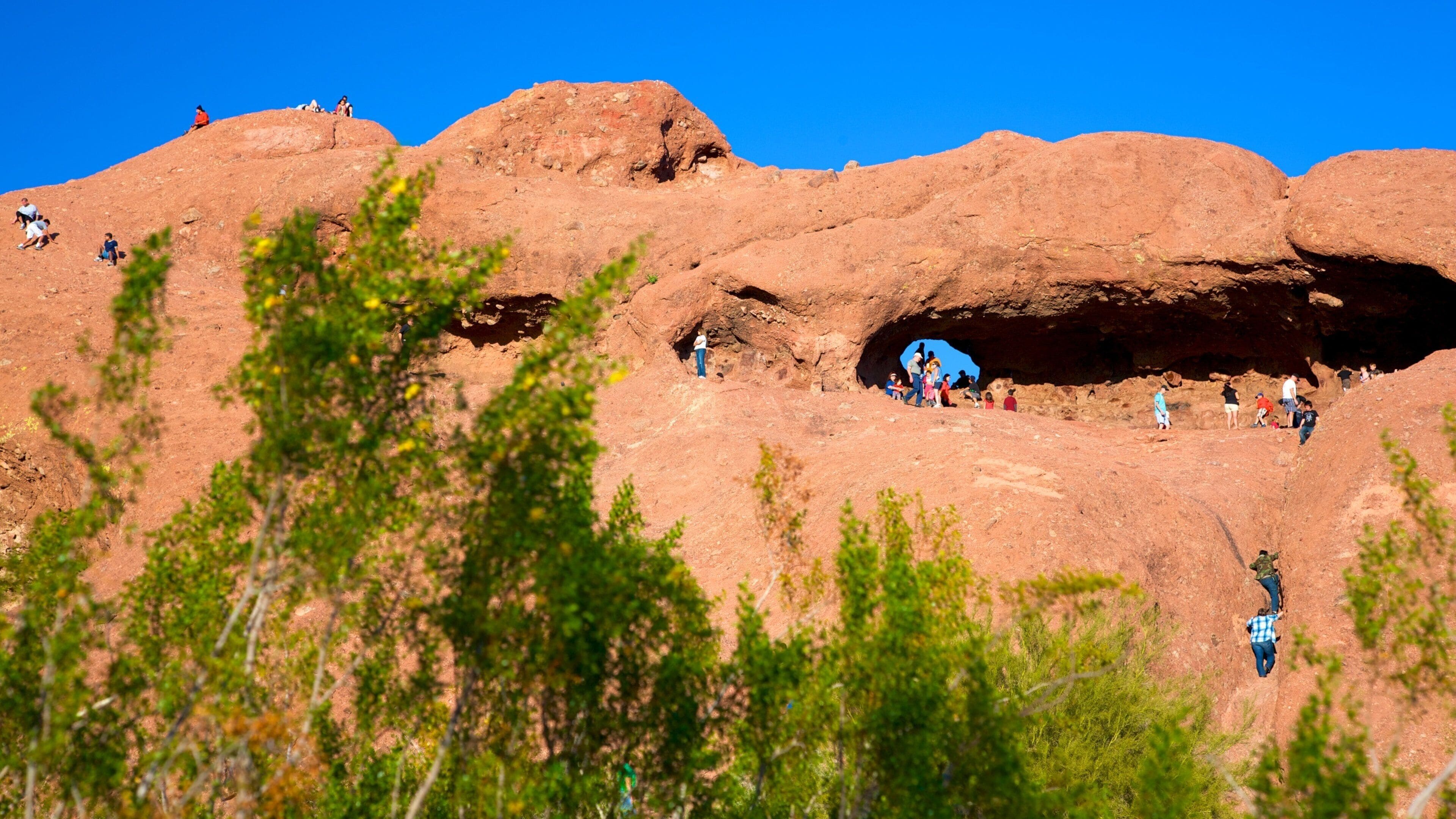Hole in the Rock showing mountains and climbing
