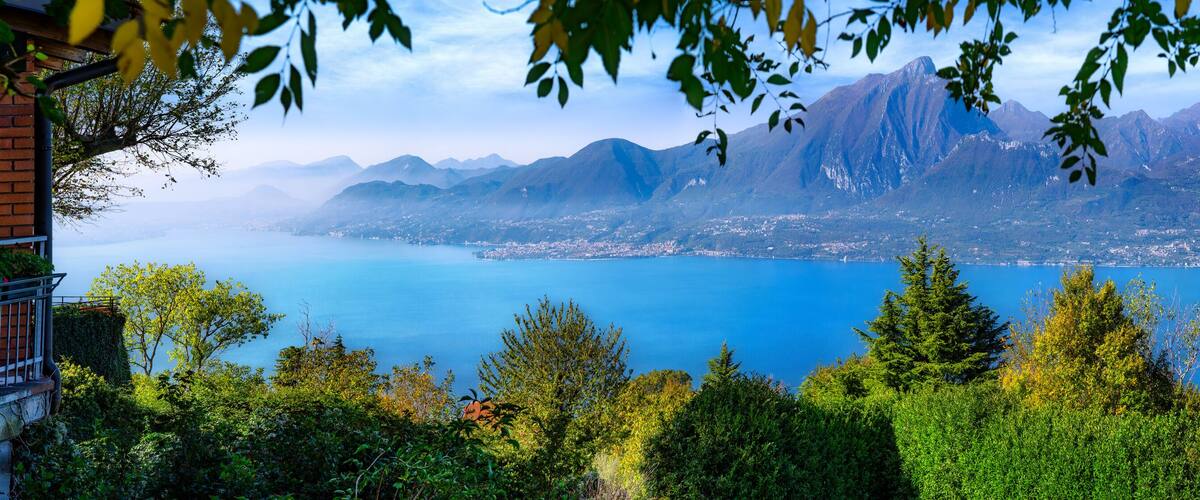A mountainous landscape with a lake and a town in the valley.
