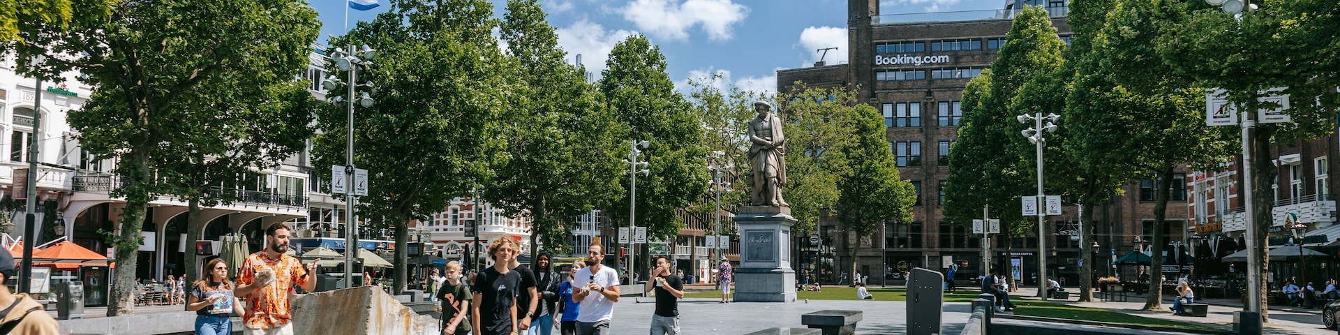 Amsterdam City Centre featuring a statue or sculpture and street scenes