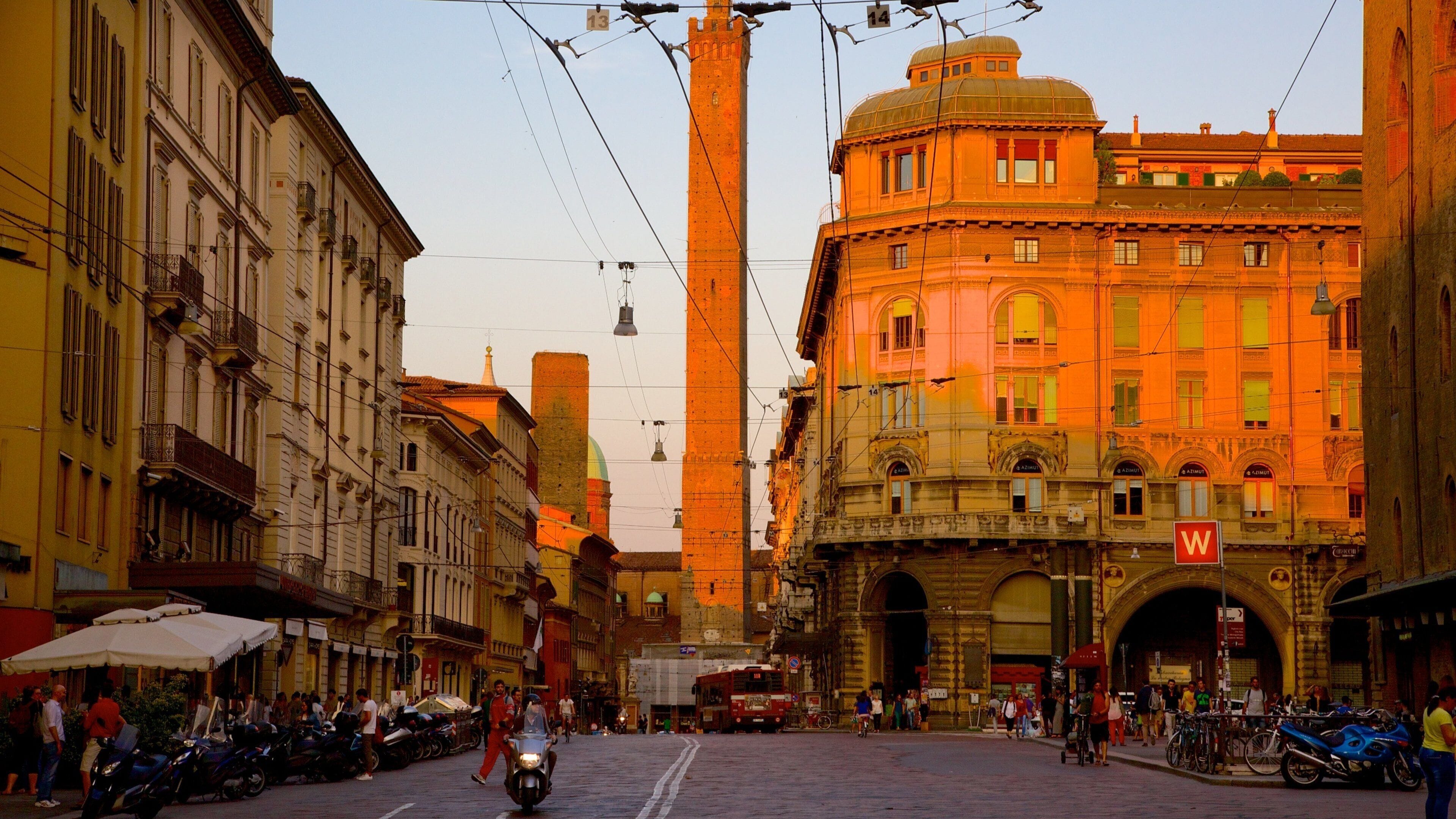 Bologna featuring a city, a sunset and street scenes