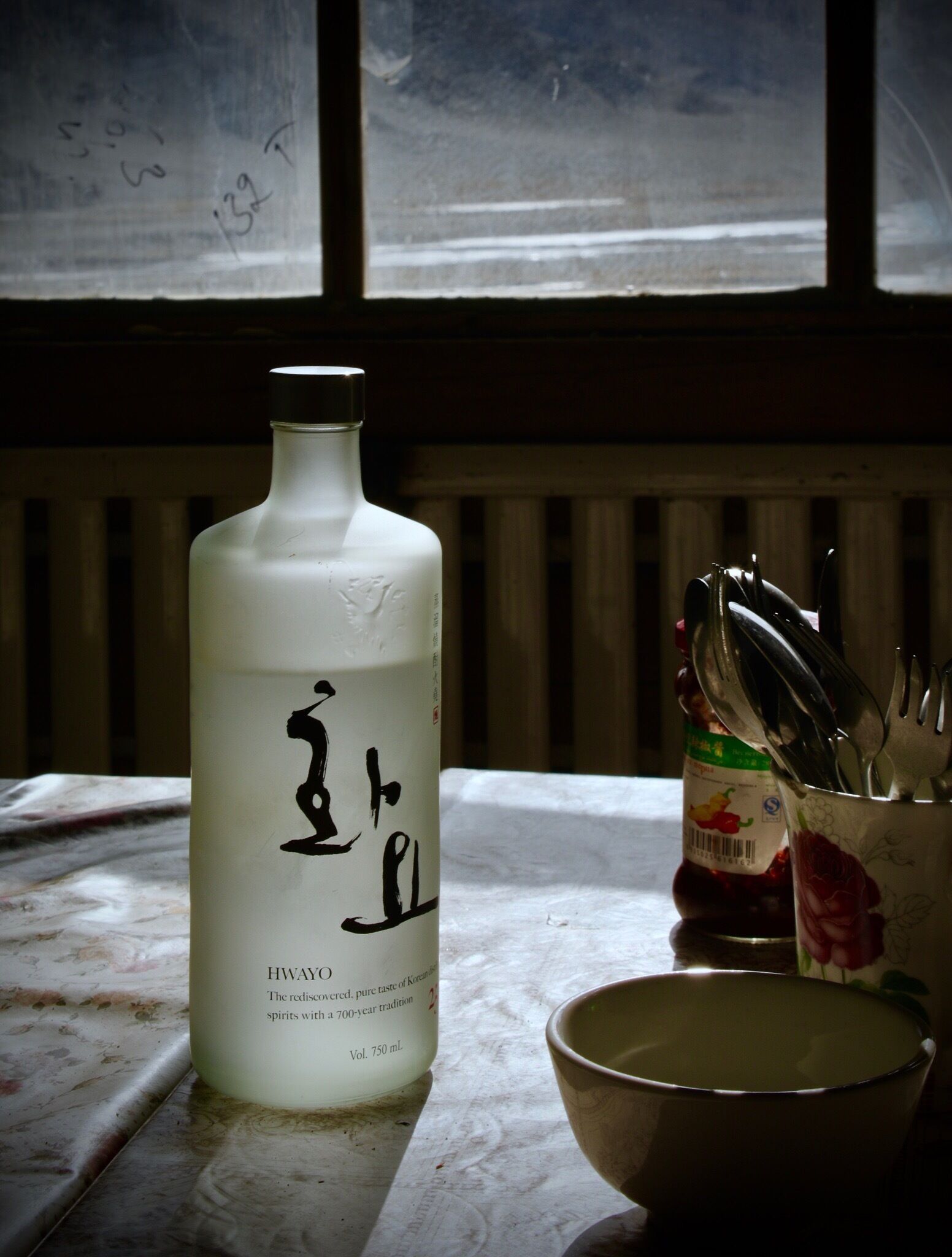 In a wayside canteen , on the road to Ulgii, Mongolia. A quick lunch stop. Usually dumplings and our own shot of Korean Soju ( rice wine ) to keep warm . Temperatures of -30C. 