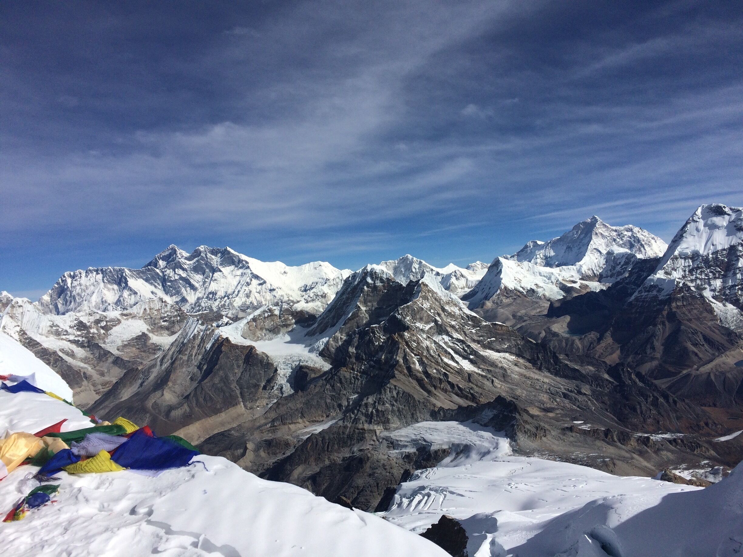 A snow-covered mountain range with peaks and glaciers.