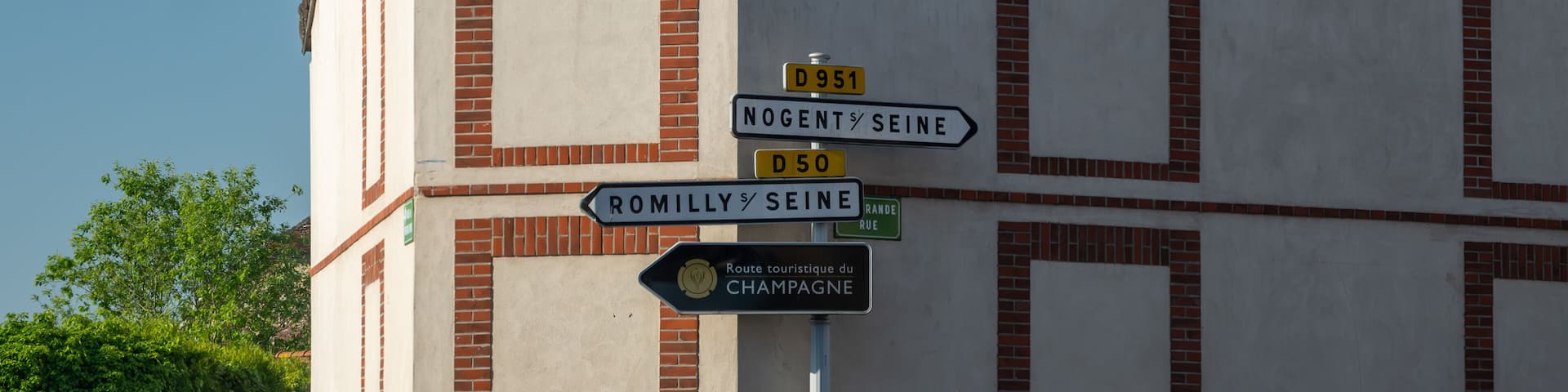 Driving in Champagne wine making region in Champagne, France. Streets, houses, road signes and places of destinations in summer