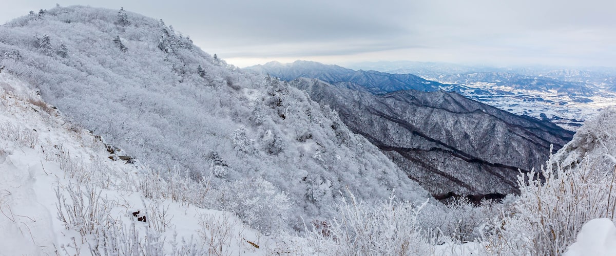 Snow-capped Deogyusan mountains on a clear day in winter, South Korea.