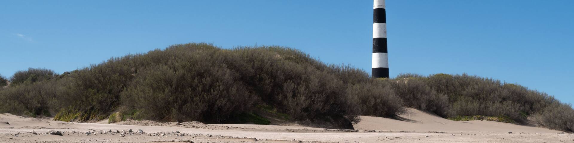 Lighthouse on a dune of sand. Atlantic coast of South America. Claromeco, Argentina