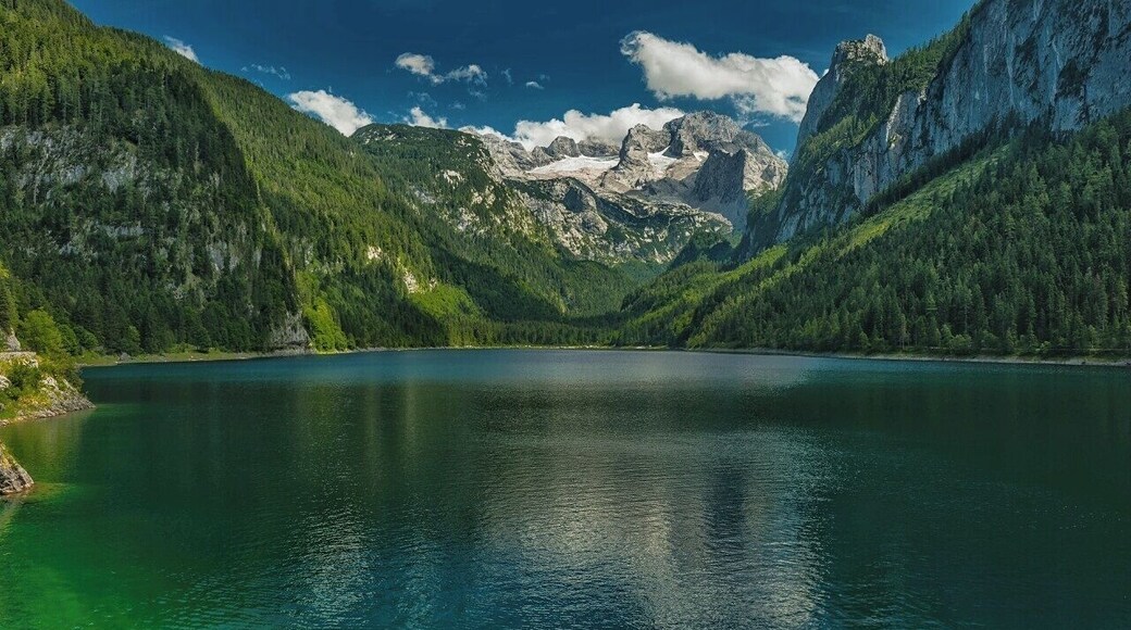 July 2015
Vorderer Gosausee lake, Salzkammergut, Austria
Vorderer Gosausee is a natural mountain lake in alt. ca. 1.000 meters. It is 1,8 km long and 500 meters wide. It is deep on average 35 meters and due to its clear water it is popular with the divers. On the east side it is surrounded by the Dachstein massif and glacier. The glacier is the source of the water of the lake filling it with underground streams. Dachstein has prominence of 2.000 metres over the lake which gives just an impressive view.