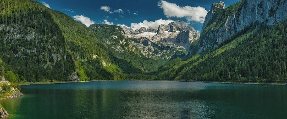 July 2015
Vorderer Gosausee lake, Salzkammergut, Austria
Vorderer Gosausee is a natural mountain lake in alt. ca. 1.000 meters. It is 1,8 km long and 500 meters wide. It is deep on average 35 meters and due to its clear water it is popular with the divers. On the east side it is surrounded by the Dachstein massif and glacier. The glacier is the source of the water of the lake filling it with underground streams. Dachstein has prominence of 2.000 metres over the lake which gives just an impressive view.