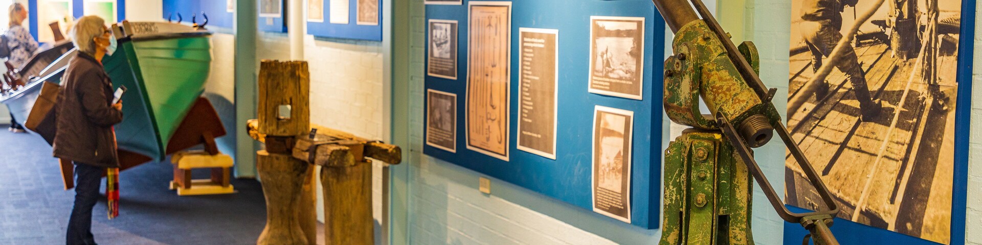 Eden Killer Whale Museum featuring heritage elements as well as an individual femail