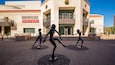 A theater building with a sign reading "Herberger Theater Center" and three statues of dancers in front.