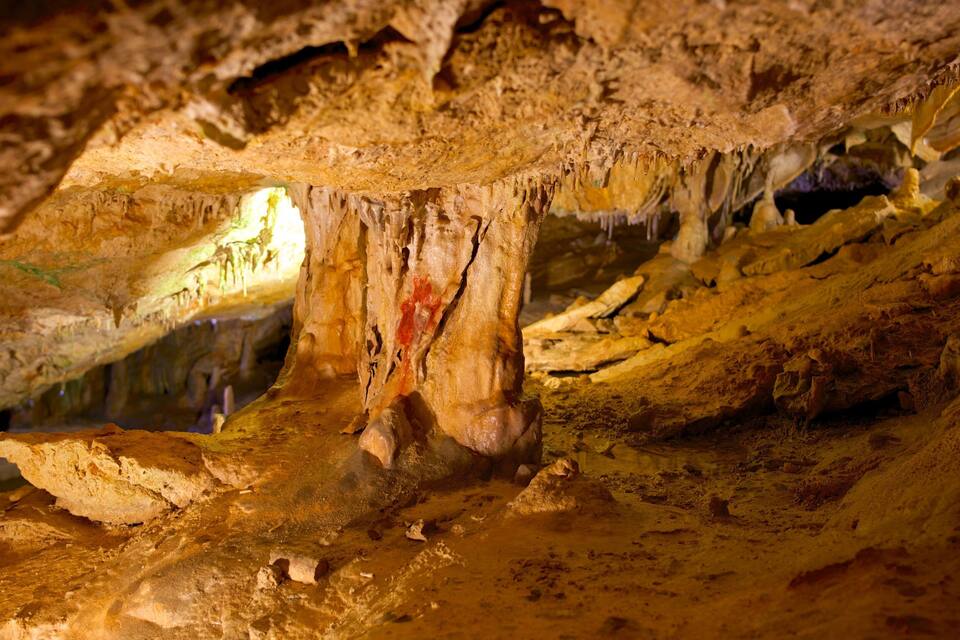 A cave with stalactites and stalagmites.