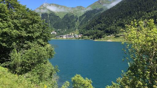 A photo of the lake, and the ski slopes in the background