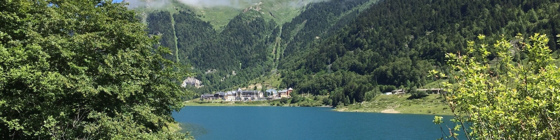 A photo of the lake, and the ski slopes in the background