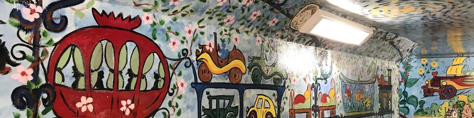 Scene depicting in underground passageway at train station in Auvers