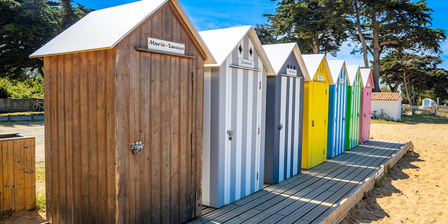 Front of multicolored bath cabins of the beach of La Bree-les-Bains, France