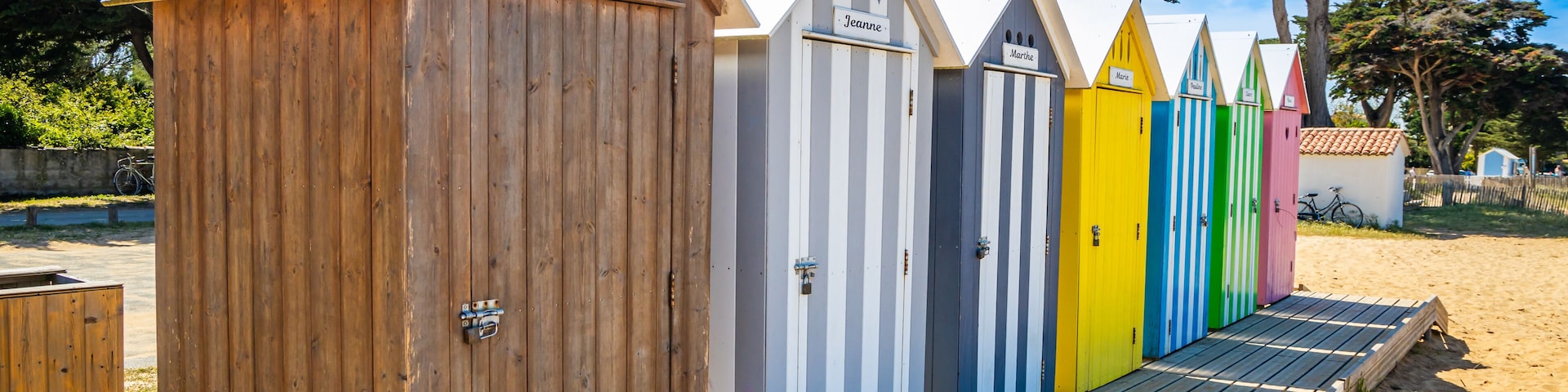 Front of multicolored bath cabins of the beach of La Bree-les-Bains, France