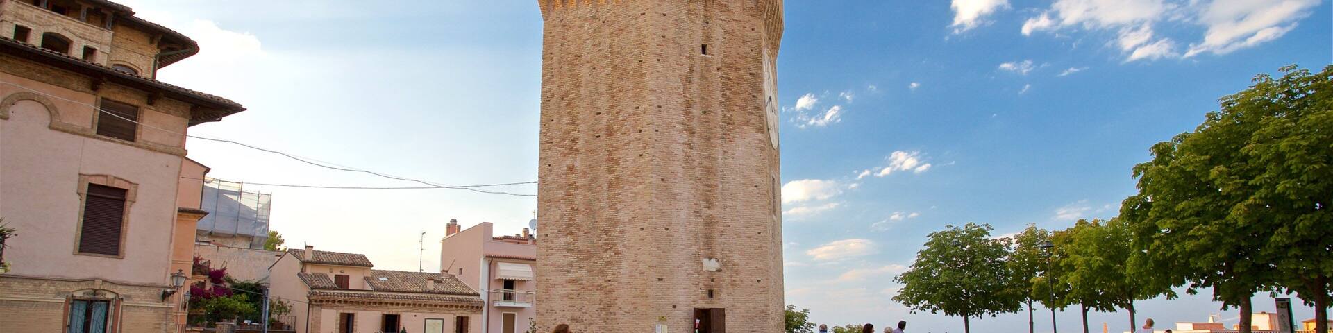 Tower of Gualtieri featuring a sunset and heritage architecture