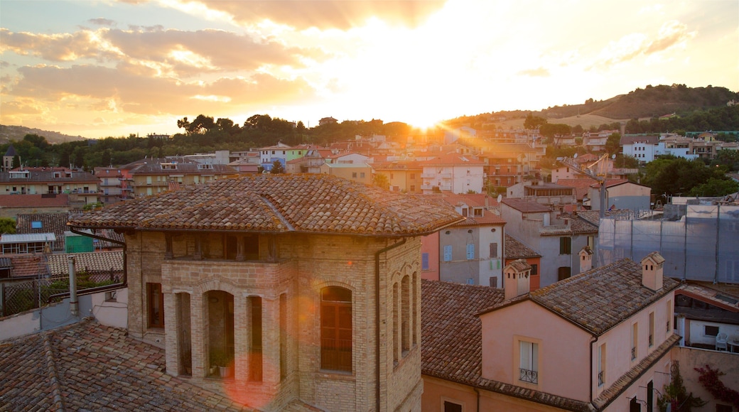 Tower of Gualtieri featuring a city, landscape views and a sunset