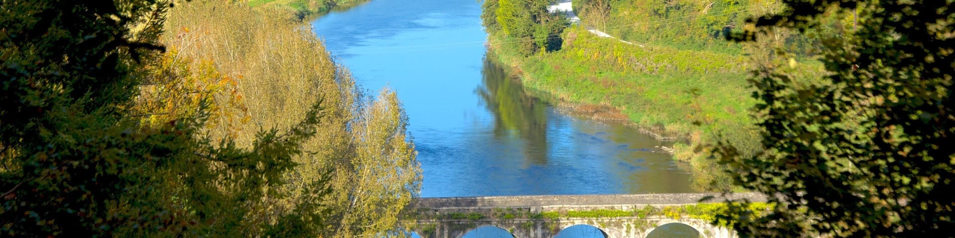 Inistioge which includes a river or creek, landscape views and a bridge