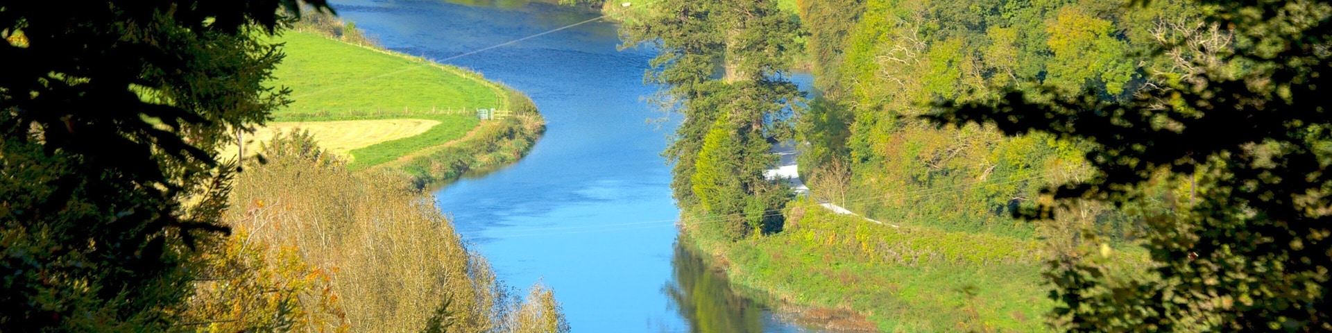 Inistioge which includes a river or creek, landscape views and a bridge