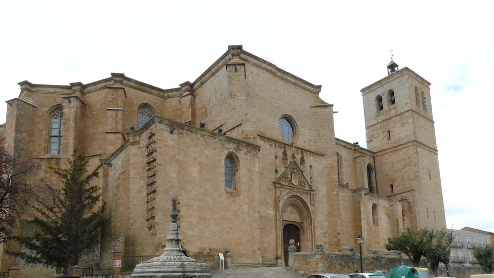 A historic church with a bell tower and a large arched entrance.