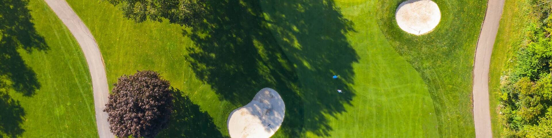 Aerial view of a golf course fairway and sand traps in autumn creating an abstract looking perspective at Arrowhead Golf Course in Wheaton, IL - USA
