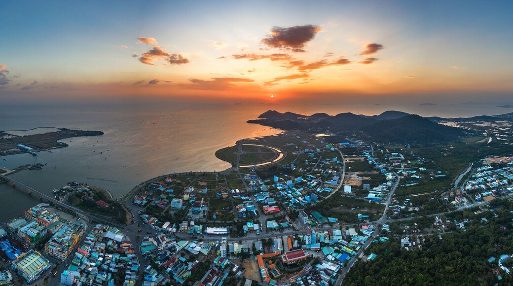 Top view aerial of Ha Tien City with development buildings, transportation, energy power infrastructure. Famous tourist city of Vietnam, sharing the border with Cambodia