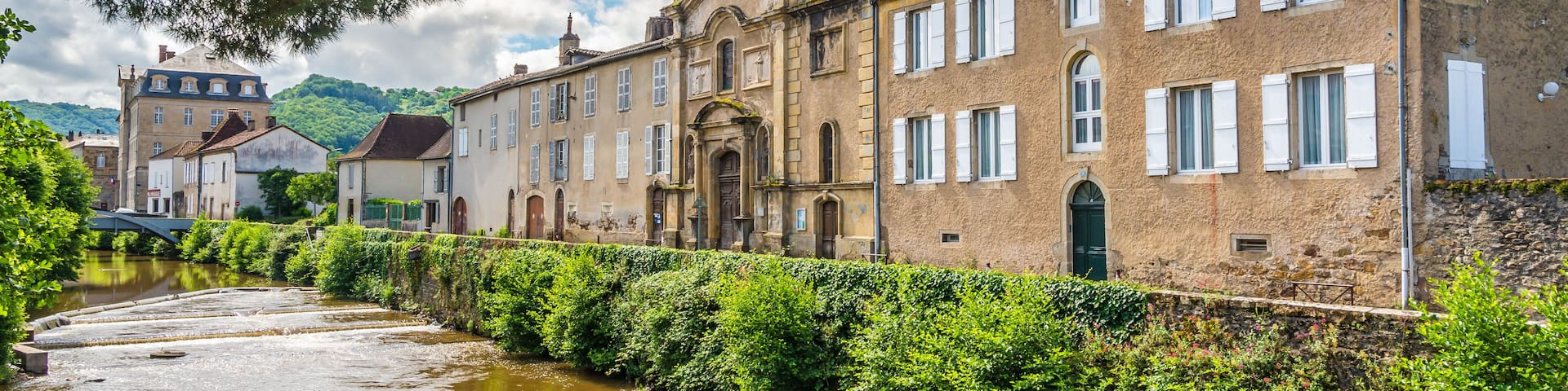View at the Recollets Church and banks of Bave river in Saint Cere town - France